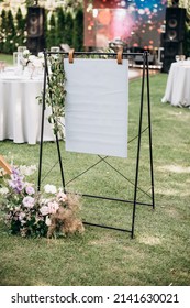 Seating Chart Decorated With Flowers At A Wedding Banquet