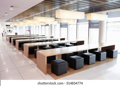 Seating In The Empty Cafeteria Of A Large Business