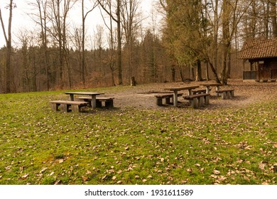 Seating group with benches and a table in a clearing in the forest