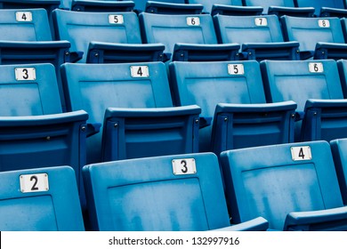 Seating Rows In A Stadium With Weathered Chairs