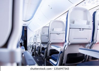 Seats in cabin plane. passenger aircraft cabin. Low cost flights from airlines