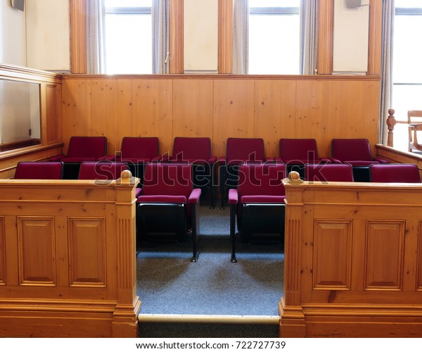 Seats of the jury box in\
a courtroom 