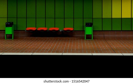 Seats at a subwaystation with green wall in Dortmund, Germany