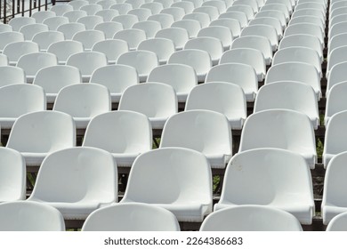 Seats of tribune on sport stadium. Concept of fans, chairs for audience, cultural environment concept. mpty seats, modern stadium. - Shutterstock ID 2264386683
