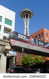 Seattle - August 07, 2022; Seattle Monorail Wrapped In Pepsi Zero Sugar Advertising On Elevated Track Infront Of Space Needle