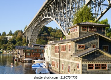 Seattle - August 14, 2022; Aurora Bridge Carries State Route 99 Over Houseboats In Seattle With Rower On Water