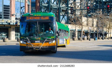 Seattle - January 22, 2022; Articulated Metro Bus In Seattle Turning A Corner,  The Public Transportation Is On Route 24 To Westwood Village