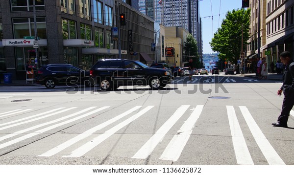 SEATTLE - JUL 15, 2018 - Cross traffic on\
street in downtown Seattle,\
Washington