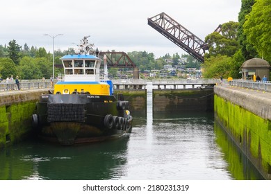 Seattle - July 18, 2022; Tug Boat Pacific Titan Waits In The Large Ballard Lock As The Gate Closes Before Proceeding From Salt Water To Fresh Water