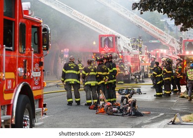 Seattle - June 30, 2022; City Of Seattle Fire Department Teams Wait While Ladder Trucks Work A Fire In An Unstable Building In The Belltown Neighborhood