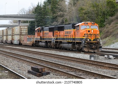 Seattle - March 20, 2022; BNSF Intermodal Freight Train Passing Southbound Through Seattle With Multiple Rail Tracks