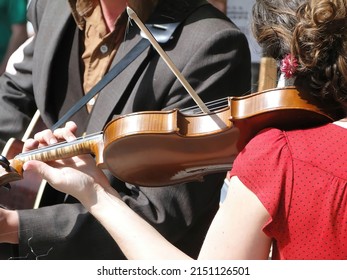 SEATTLE - MAY 15, 2010 -  Female Violinist Plays With Her Band  At The U District Street Fair In Seattle Washington