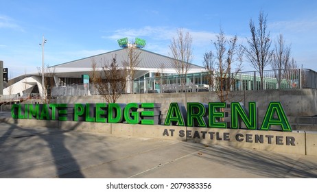 Seattle - November 21, 2021; Shadows Of Trees Cross The Sidewalk And Touch The Sign For The Climate Pledge Arena In Seattle Under A Blue Sky