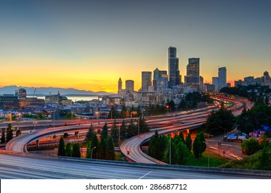 Seattle Skylines And Highway Traffic Motion In The Sunset. The View From Rizal Park In Seattle, Washington, US. City Scape And High Speed Concept.