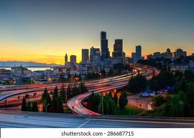 Seattle Skylines And Highway Traffic Motion In The Sunset. The View From Rizal Park In Seattle, Washington, US. City Scape And High Speed Concept.