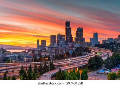 Seattle Skylines And Highway Traffic Motion In The Sunset. The View From Rizal Park In Seattle, Washington, US. City Scape And High Speed Concept.