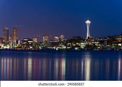 Seattle Skylines with light reflection on Lake Union in blue hour. The view from Gas Works Park a tourists attraction and popular local place.