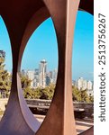 Seattle Space Needle on a sunny day through a sculpture in Kerry Park on Queen Anne Hill