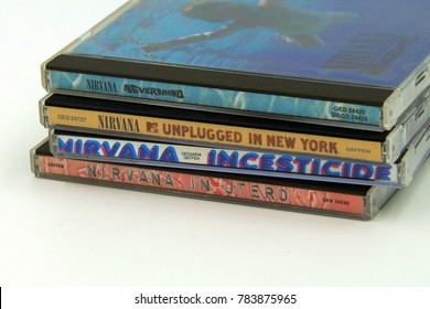 Seattle, U.S. - December 30, 2017: Compact Disc (CD) Albums Nevermind, Incesticide, In Utero And MTV Unplugged In New York, Of The American Grunge Rock Band Nirvana.