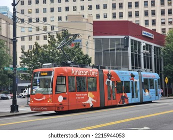 Seattle, USA - Aug 26 2022 : A View Of  Two Colors Seattle Link Light Rail In Front Of The Bank Of America. 