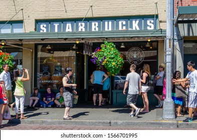 SEATTLE, USA, - JULY, 12, 2012: Tourist Visit The First Starbucks Coffee Which Opened In Pike Place, Seattle USA.