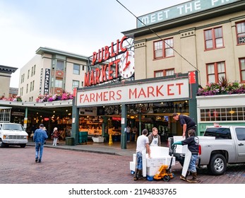 Seattle USA - July 20 2008; Pyke Place Famous Farmers Market And Tourist Attraction Providing Artisan And Specialty Food And Produce.as Workers Arrive To Unload Produce At 8.00am.