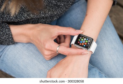 SEATTLE, USA - July 27, 2015: Woman Using Apple Watch. Multiple Apps View.