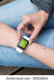 SEATTLE, USA - July 27, 2015: Woman Using Activity App On Apple Watch. 