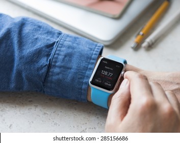 SEATTLE, USA - June 5, 2015: Man Wearing Sport Apple Watch With Blue Rubber Band. 