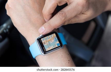 SEATTLE, USA - May 30, 2015: Man Using Maps App On Apple Watch While Driving Car