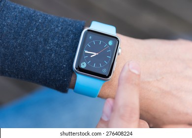 SEATTLE, USA - May 8, 2015: Man Using Watch App On Apple Watch To Check Time.