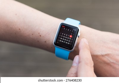 SEATTLE, USA - May 8, 2015: Man Using Calendar App On Apple Watch To Check Schedule.