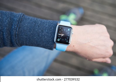 SEATTLE, USA - May 8, 2015: Man Using Watch App On Apple Watch To Check Time.