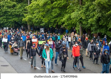 Seattle, WA -12 June 2020 Silent March at Jefferson Park, downtown. Black Lives Matter. People on streets with posters and signs. Solidarity march.