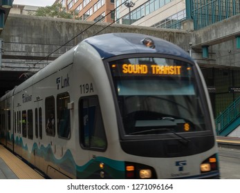 Seattle, WA AUGUST 26, 2018: Sound Transit Link Light Rail Pulling Into Outdoor Station