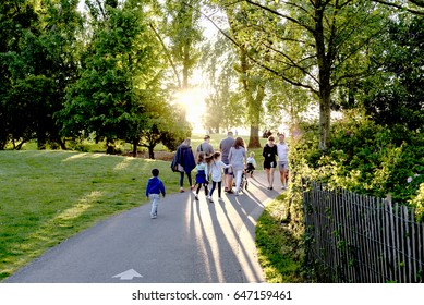  Seattle, Wa Circa Spring 2020, Large Multi-generational Family Walking Through A Beautiful Sun Lit Park, Evening Sun. 