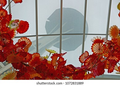 Seattle, WA, December 29, 2017: The Space Needle Seen Through The Conservatory With Glass Art By Chihuly