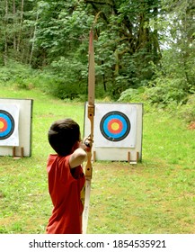 Seattle, WA - June 10, 2015: Boy Participating In Boy Scouts Of America Run Archery Event.