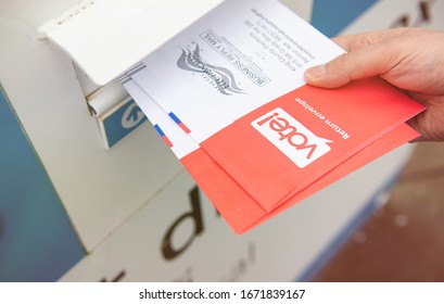 Seattle, WA - March 10, 2020: Washington State's Mail in Ballots for Presidential Primary Elections Being Dropped off at Designated Collection Box