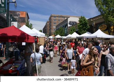 SEATTLE, WA – MAY 17 :  Crowds explore the crafts booths  at a street fair on May 17, 2009  in Seattle, WA.