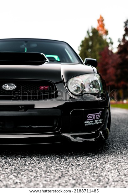 Seattle, WA, USA\
April 19,\
2022\
Black Subaru STI showing the front of the car and the hood\
scoop