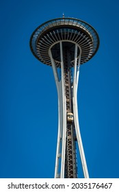 SEATTLE, WA, U.S.A. - AUG. 18. 2021: Close Up Photo Of The Space Needle With Yellow Elevator Running Up The Side Of It.  