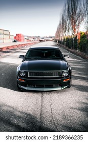 Seattle, WA, USA
August 11, 2022
Green Ford Mustang Parked With Trees On The Right Of The Car