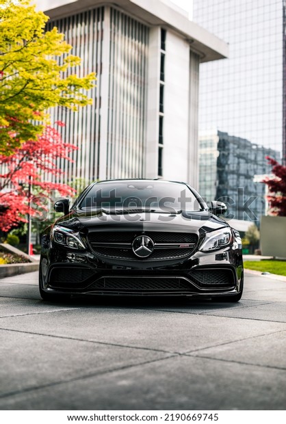 Seattle, WA, USA\
August 12, 2022\
Black\
Mercedes C63 S parked showing the front of the car with a building\
in the background