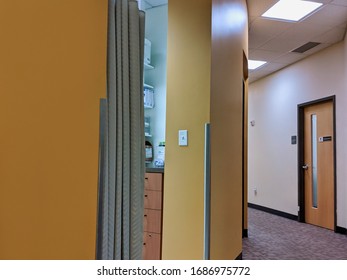 Seattle, WA / USA - Circa March 2020: View Of A Curtained Off Room In The Hallway Of A Medical Hospital, Different First Aid Supplies Peaking Out From The Shelves.