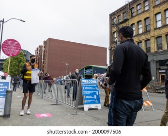 Seattle, WA USA - Circa May 2021: An Indian Man Entering The Line At A Covid Vaccine Center At Lumen Field In Downtown Seattle.