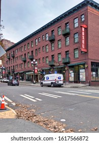 Seattle, WA / USA - Circa November 2019: Local USPS Mail Carrier Van Making Its Deliveries In Downtown Seattle On A Saturday Afternoon.