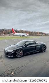 Seattle, WA, USA
Feb 2, 2022
Black Audi R8 parked sideways at an airport with a plane in the background