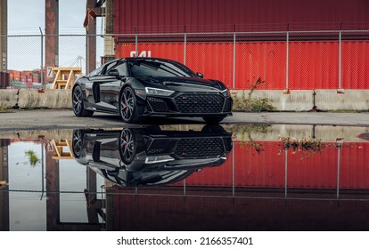 Seattle, WA, USA
Feb 2, 2022
Black Audi R8 parked with the cars reflection being cast in a puddle