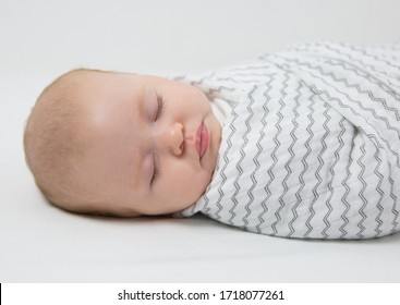 Seattle, WA / USA - February 2018: Safe Sleep Environment For Baby In Cotton Muslin Mini ZigZag Swaddle By SwaddleDesigns